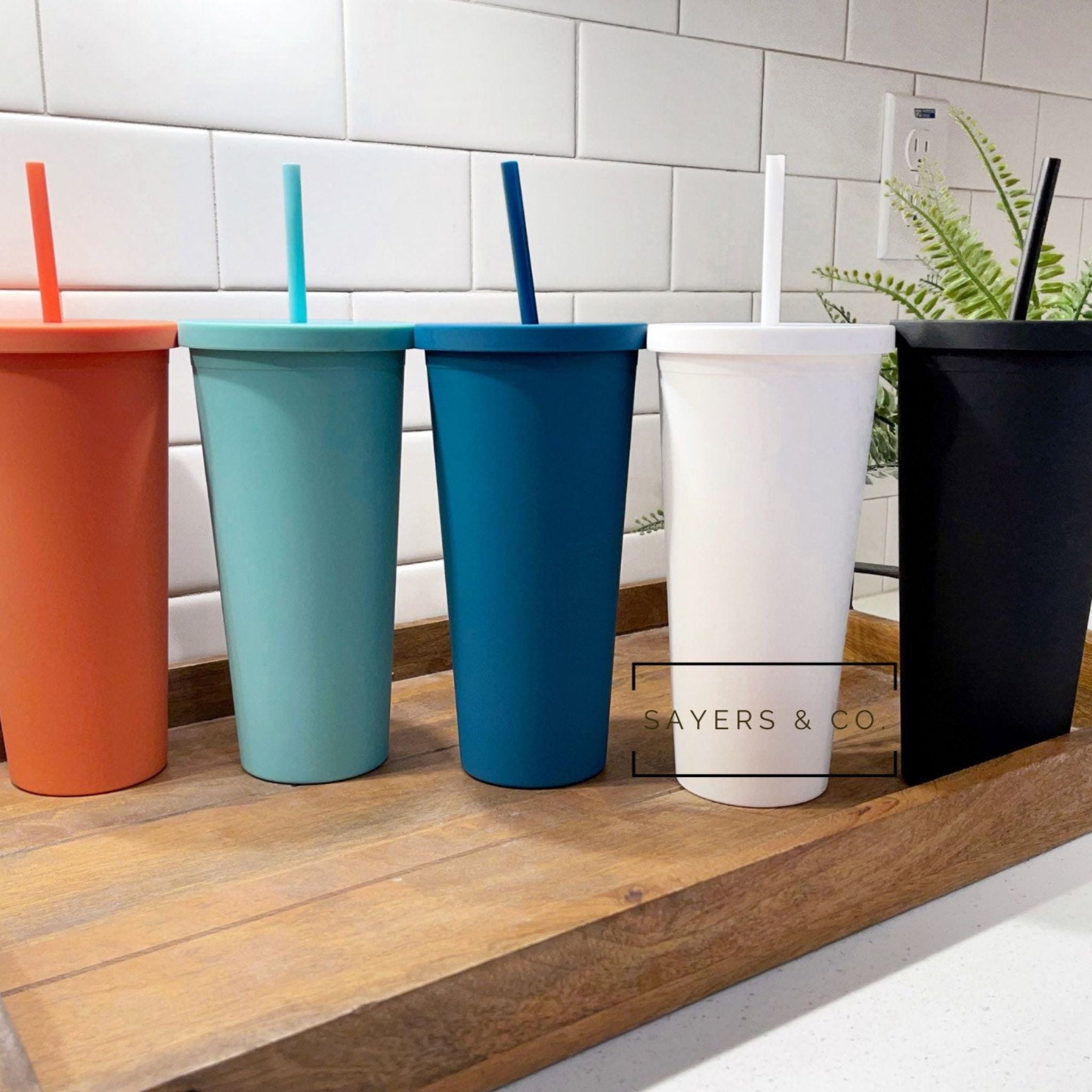 https://www.sayersandco.com/cdn/shop/products/22oz-Acrylic-Matte-Colored-double-walled-insulated-blank-tumbler-Orange.jpg?v=1691279767